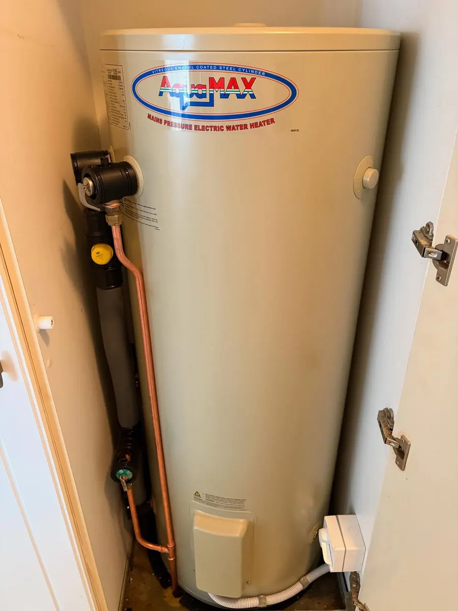 New AquaMax mains pressure electric hot water system installed in the same cupboard